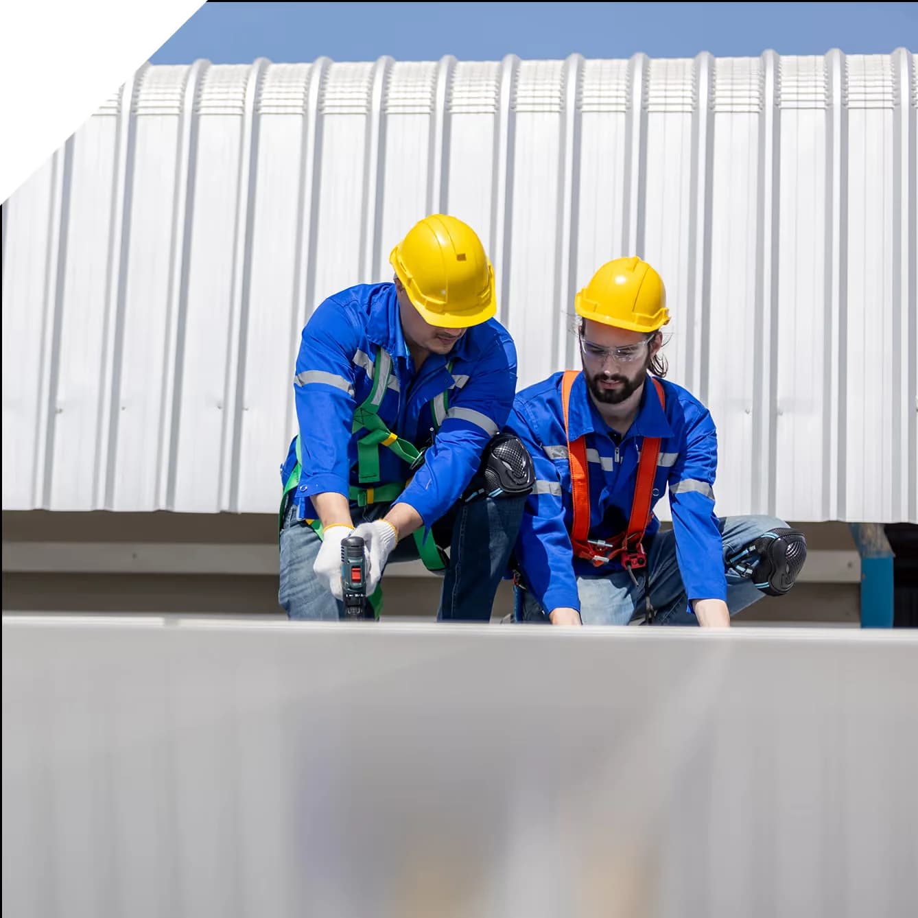 repair crew working on a commercial roof