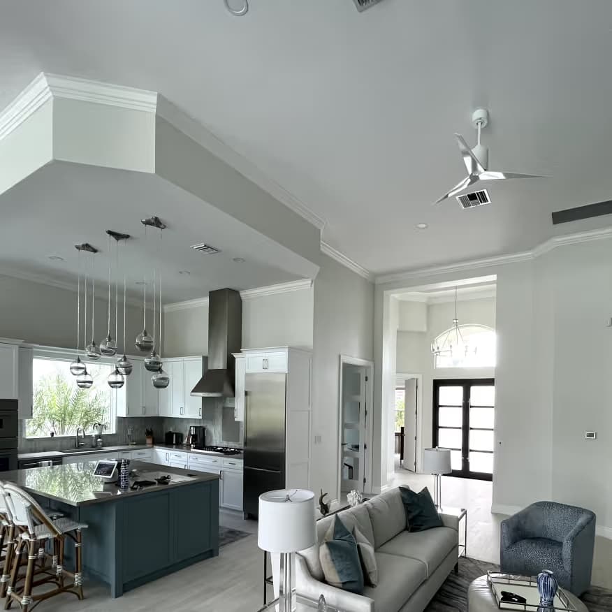 A freshly painted residential kitchen and living room